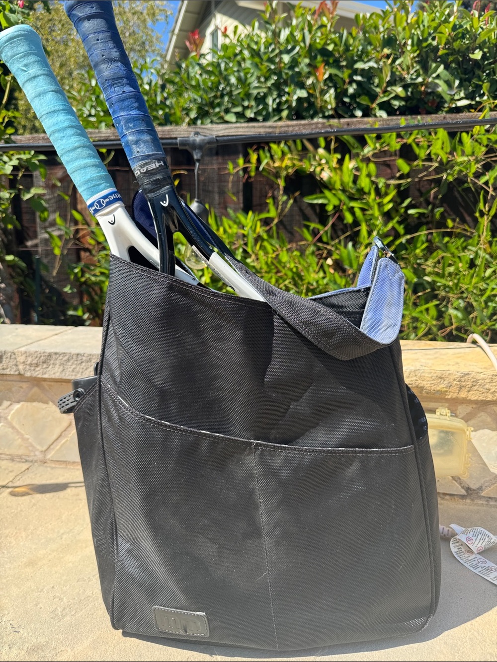 Black Tennis Tote Bag with zebra print liner and purple accents.